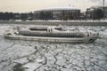 Moscow - March 3, 2018. Moscow pleasure craft sailing along the Moscow-River covered with a broken ice in early spring.