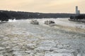 Moscow - March 3, 2018. Two ships sailing along the Moscow-River covered with a broken ice towards each other