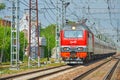 MOSCOW, MAY, 18, 2018: Diagonal perspective view on electric locomotive EP2K with sleeping coaches on railway tracks. Russian rail