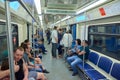 MOSCOW, MAY, 13, 2018: Different people traveling in russian modern subway passenger train. Mass transit metro electric transport.