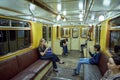 MOSCOW, MAY, 13, 2018: Different people traveling on russian retro subway passenger train. Mass transit metro electric transport.