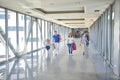 MOSCOW, MAY 25, 2018: View on walking people in airport terminal hall. Modern architecture made of glass windows and metal. Family Royalty Free Stock Photo