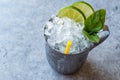 Moscow Mule Cocktail with Lime, Mint Leaves and Crushed Ice in Metal Cup. Royalty Free Stock Photo