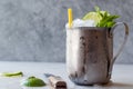 Moscow Mule Cocktail with Lime, Mint Leaves and Crushed Ice in Metal Cup. Royalty Free Stock Photo