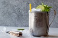 Moscow Mule Cocktail with Lime, Mint Leaves and Crushed Ice in Metal Cup. Royalty Free Stock Photo