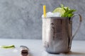 Moscow Mule Cocktail with Lime, Mint Leaves and Crushed Ice in Metal Cup. Royalty Free Stock Photo