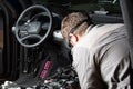 Moscow. November 2018. A mechanic repairs an Audi ... Repairing wiring, gearboxes, disassembled interior premium crossover.