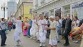 MOSCOW - OCTOBER 10: Hare Krishna devotees with hands held high, singing and dancing through the street on October 10