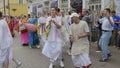 MOSCOW - OCTOBER 10: Hare Krishna devotees with hands held high, singing and dancing through the street on October 10