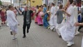 MOSCOW - OCTOBER 10: Hare Krishna devotees with hands held high, singing and dancing through the street on October 10