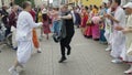 MOSCOW - OCTOBER 10: Hare Krishna devotees with hands held high, singing and dancing through the street on October 10