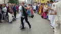 MOSCOW - OCTOBER 10: Hare Krishna devotees with hands held high, singing and dancing through the street on October 10