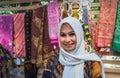 Moscow,Park on Krasnaya Presnya,August 05, 2018: Portrait of cute older woman from Indonesia in white scarf smiling and looking at Royalty Free Stock Photo