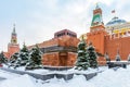 Moscow Red Square in winter, Russia. Lenin`s Mausoleum by Moscow Kremlin under snow Royalty Free Stock Photo