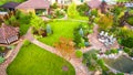 Landscape design at residential house taken from above. Beautiful landscaping in home garden in summer Royalty Free Stock Photo