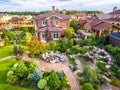 Landscape design at residential house taken from above. Beautiful landscaping in home garden in summer Royalty Free Stock Photo