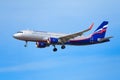 Close up view of a airplane of the Russian Airlines `Aeroflot` flies in azure sky editorial