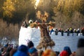 Straw scarecrow and ice fort full of people, Bakshevskaya Shrovetide maslenitsa celebration