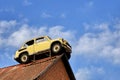 Moscow region, Russia - July 15, 2019: Old soviet car on a roof of a garage