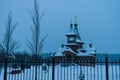 Moscow region, Russia, 01.22.2019. Rustic wooden Christian Church on white snow background