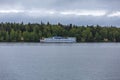 Comfortable double-deck ship is sailing on the river