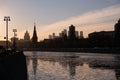 Moscow river, embankment and silhouettes of buildings and towers on sunset