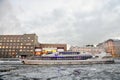 A cruise yacht sails on the Moscow river. Color winter photo. Royalty Free Stock Photo