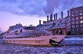 A cruise yacht sails on the Moscow river. Color winter photo. Royalty Free Stock Photo