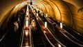 Moscow, Russa - February 22, 2015: Deep subway station is crowded with people riding the escalators down