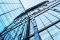 Moscow, Russia - April 13, 2021: Abstract bottom view of the glass facade of a modern building with graphic line reflections