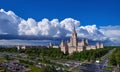 Aerial panoramic view of sunny campus buildings of famous Moscow university under dramatic cloudy sky in spring Royalty Free Stock Photo