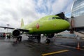 Airbus A319 airplane of S7-Siberia Airlines at a passenger telescopic gangway at Domodedovo International Airport Royalty Free Stock Photo