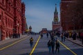 MOSCOW, RUSSIA- APRIL, 24, 2018: Below view with people walking in the streets and the building of the State Historical