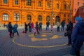 MOSCOW, RUSSIA- APRIL, 29, 2018: Below view with people walking in the streets and the building of the State Historical