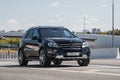 Moscow Russia - 19 April 2019 black mercedes benz ml w164 parked on highway overpass near city. Clearsky