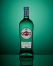 Moscow, Russia - APRIL 27, 2020: Bottle of Martini Bianco on green background with reflection