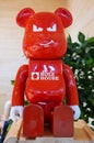 Moscow, Russia - April 21, 2023: Branded toy in the form of a red plastic bear with the inscription the name of the construction