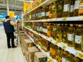 Moscow, Russia - April 14. 2018. buyer chooses sunflower oil in the Auchan store