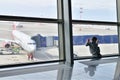 Moscow, Russia - April 4. 2018. child through window looks at plane in airport Vnukovo