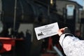 Moscow, Russia - April 1.2017. Childs hand keeps a discount ticket in Museum of History of Railway Transport Development