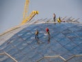 Group of workers climbers wash the glass dome in the park Zaryadye. Work at height. Moscow, Russia - April 27, 2019 Royalty Free Stock Photo