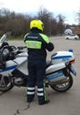 The inspector of the road police patrol on the service motorcycle controls the road.