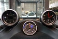 Moscow, Russia - April 23, 2019: Interior details of a sports car Porsche. Sports chronometer with electronic clock, compass or