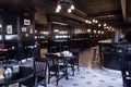 Moscow, Russia - April 04, 2012: Interior of Irish pub, dark colors, in day, no visitors, staff. Restaurant business concept,