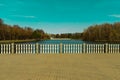 Moscow, Russia April 18 2021: Izmailovsky park pond stone balustrade with white columns springtime