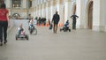 Moscow, Russia - April 12, 2019: Kids riding bicycles, scooters and small cars in the hall of intertainment center -