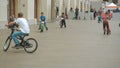 Moscow, Russia - April 12, 2019: Kids riding bicycles, scooters and small cars in the hall of intertainment center -