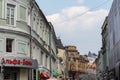 Moscow, Russia - April 27, 2019: Kuznetsky most street, view of the branch of the modern Alfa Bank and the old pre-revolutionary