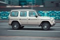 Man driving Mercedes-Benz G-class in the city street on high speed. Fast moving black SUV car on the highway road Royalty Free Stock Photo