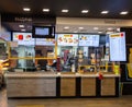 A McDonald's fast food restaurant in a mall, it is empty